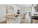 Modern kitchen featuring stainless steel appliances, granite countertops, and an island with bar seating at 1007 Swamp Rose Run, Summerville, SC 29485