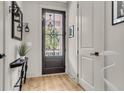 Stylish foyer with decorative mirror, lamps, and a view of the charming front door at 1093 Ave Of Oaks, Charleston, SC 29407