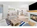 Bright living space with fireplace, modern furnishings, and open floor plan to the kitchen and dining area at 1355 Dunlin Ct # Share D, Kiawah Island, SC 29455