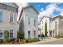 Neat, two-story home with white exteriors, complimented by healthy yard landscaping and manicured lawn at 137 Bratton Cir, Mount Pleasant, SC 29464