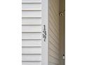 Close-up of the house number '137' on the white siding of a modern home at 137 Bratton Cir, Mount Pleasant, SC 29464