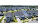 An aerial view of the community showcasing the beautiful homes, pond, and lush landscaping at 1787 Timmons St, Mount Pleasant, SC 29466