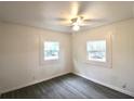 A bright, empty bedroom with wood-look flooring and white paneled walls at 1925 Kerry St, North Charleston, SC 29406