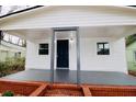 Charming home with a welcoming front porch, dark-blue door, and brick foundation at 1925 Kerry St, North Charleston, SC 29406