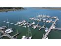 Overhead shot of a marina showcasing numerous boats moored at docks in a peaceful waterway at 2 Mcdonough Rd # B-11, Folly Beach, SC 29439