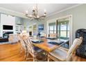 Elegant dining room adjacent to the living area with glass doors to backyard at 2363 Palmer Creek Bnd, Charleston, SC 29412