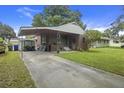 Brick home with covered carport and long driveway at 2703 Phyllis St, North Charleston, SC 29405