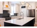 Modern kitchen featuring a large island, stainless steel appliances, and pendant lighting at 3025 Rampart Rd, Summerville, SC 29483