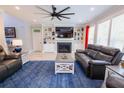 Comfortable living room with fireplace, built-in shelving, and modern furnishings at 3025 Rampart Rd, Summerville, SC 29483