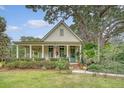 Inviting home with a classic design, well-manicured lawn, and lush landscaping at 312 Hobcaw Dr, Mount Pleasant, SC 29464