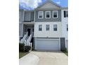 Charming townhouse with gray and white siding, a two-car garage, and a private entrance staircase at 313 Lanyard St, Johns Island, SC 29455