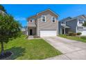 Two-story home with a well-maintained lawn, driveway, and attached two-car garage at 354 Iveson Rd, Summerville, SC 29486