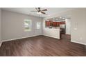 Open concept living room with hardwood floors and view into the kitchen area at 354 Iveson Rd, Summerville, SC 29486