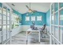 Comfortable office space with lots of natural light and a modern ceiling fan at 359 Whispering Breeze Ln, Summerville, SC 29486