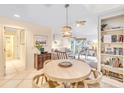Bright dining area features modern table and chairs along with a built-in bookcase at 4403 Sea Forest Dr, Kiawah Island, SC 29455