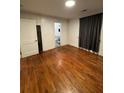Bedroom with hardwood flooring and en suite bathroom at 4406 Holmes Ave, North Charleston, SC 29405