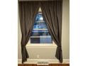 Window with natural light and privacy curtains at 4406 Holmes Ave, North Charleston, SC 29405