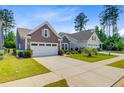 Charming single story home with landscaped yard and a two car garage at 5078 Song Sparrow Way, Summerville, SC 29483