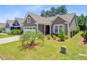 Charming single story home with landscaped yard and a two car garage at 5078 Song Sparrow Way, Summerville, SC 29483