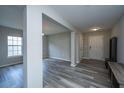 Inviting foyer featuring wood look flooring and neutral paint that flows into the living areas at 5128 Thornton Dr, Summerville, SC 29485