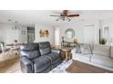 Cozy living room with contemporary furniture, wood-look flooring, and an open concept layout at 7935 Parklane Ct # A, North Charleston, SC 29418
