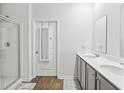 Bathroom featuring double sink vanity, modern fixtures, and glass-enclosed shower at 849 Kirby Ct, Charleston, SC 29414