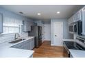 Updated kitchen features stainless steel appliances, subway tile backsplash, and modern countertops at 1005 Trotters Blvd, Summerville, SC 29483
