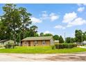 Attractive home with brick accents and mature trees at 109 Rahway Rd, Goose Creek, SC 29445