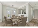 Comfortable dining area featuring a round table, seating for six, and backyard access at 130 River Landing Dr # 2310, Daniel Island, SC 29492