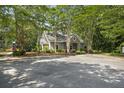 Community clubhouse nestled among trees, with well-maintained landscaping and parking, next to a playground at 132 Daniels Ridge Dr, Summerville, SC 29485