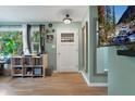 Bright entryway featuring hardwood floors, and large window views at 1549 N Avalon Cir, Charleston, SC 29407