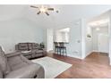 Cozy living room featuring hardwood floors, a comfortable seating arrangement, and a clear view to the kitchen at 1578 Stanwick Dr, Johns Island, SC 29455