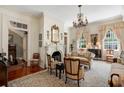 Elegant living room features a fireplace, chandelier, and classic furnishings, creating a refined space at 16 Trumbo St, Charleston, SC 29401