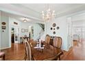 Elegant dining room with hardwood floors, a chandelier, and seating for six at 175 Basket Grass Ln, Summerville, SC 29486