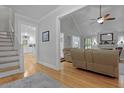Open living room with hardwood floors and views of kitchen and dining room at 189 Fox Chase Dr, Goose Creek, SC 29445