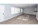 Bright living room featuring light gray walls, recessed lighting, and stylish, light-colored hardwood floors at 20 Stratton Dr, Charleston, SC 29420