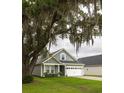 Charming single-Gathering home with manicured lawn beneath the shade of a majestic tree at 3257 Timberline Dr, Johns Island, SC 29455