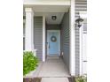 Inviting entrance with a baby blue door adorned with a charming wreath at 3257 Timberline Dr, Johns Island, SC 29455