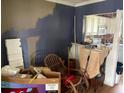 Incomplete painting of a room with a kitchen in the background at 516 Arlington Dr # B5, Charleston, SC 29414