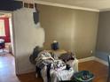 Photo of a room with partially painted wall, chair, and discarded items at 516 Arlington Dr # B5, Charleston, SC 29414