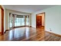 Bright living room features hardwood floors and a large bay window for plenty of natural light at 5322 Chantilly Ln, North Charleston, SC 29418