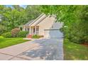 Charming single-story home with attached garage, covered porch, and well-maintained landscaping at 5347 Sundial Ct, North Charleston, SC 29418
