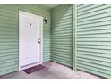 Cozy entryway featuring a white door and green siding at 6241 Rolling Fork Rd # C, North Charleston, SC 29406