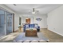 Beautiful living room with wood floors, ceiling fan, and dining area at 6241 Rolling Fork Rd # C, North Charleston, SC 29406