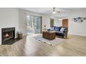 Bright living room with fireplace and sliding glass door to the patio at 6241 Rolling Fork Rd # C, North Charleston, SC 29406