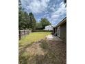 Spacious backyard featuring a patio area and a wooden fence, perfect for outdoor activities at 100 Lexington Pl, Goose Creek, SC 29445