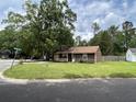 Exterior view of house with a large front yard and mature trees at 100 Lexington Pl, Goose Creek, SC 29445