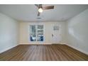 Bright living room with hardwood floors, white walls, and lots of natural light at 103 Four Iron Dr, Summerville, SC 29483