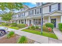 Pleasant townhome with neat landscaping, a welcoming porch area, and a traditional facade at 108 Hemingway Cir, Summerville, SC 29483