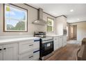 Modern kitchen with stainless steel appliances, white countertops, and ample cabinet space at 108 Swanson Dr, Summerville, SC 29483